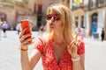 Woman taking selfie photo or sending a kiss by phone Royalty Free Stock Photo