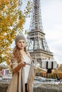 Woman taking selfie using selfie stick on embankment in Paris Royalty Free Stock Photo