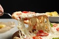 Woman taking slice of delicious pizza Margherita at table, closeup Royalty Free Stock Photo