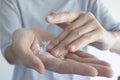 A woman is taking talcum powder to her hand