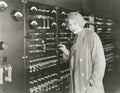 Woman taking a tour of 1930s recording studio Royalty Free Stock Photo