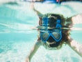 woman taking an underwater selfie while snorkeling in crystal clear tropical water Royalty Free Stock Photo