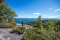 Woman taking in the view from the summit of Rattlesnake mountain