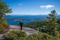 Woman taking in the view from the summit of Rattlesnake mountain