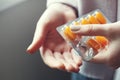 woman taking yellow pharmaceutical medical pills