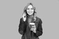 Woman talk on phone drinking coffee. Caffeine and smartphone addiction. Addiction to technology