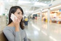 Woman talk to cellphone in departure hall Royalty Free Stock Photo