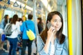 Woman talk to cellphone in train Royalty Free Stock Photo