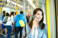 Woman talk to cellphone in train compartment Royalty Free Stock Photo