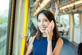 Woman talk to mobile phone inside train compartment Royalty Free Stock Photo