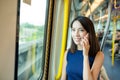 Woman talk to mobile phone in train Royalty Free Stock Photo