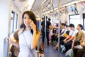 Woman talking on cellphone inside train compartment Royalty Free Stock Photo