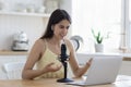 Woman talking into microphone lead on-line streaming