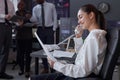 Woman talking on the phone in broking office