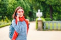 Woman talking on the phone in city park