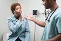 Woman talking to doctor