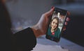 Woman talking to doctor online using smartphone, feeling bad at home, concept of telemedicine and patient counseling Royalty Free Stock Photo