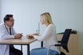 Woman talking to doctor psychiatrist in hospital