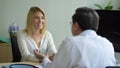 Woman talking to doctor psychiatrist in hospital