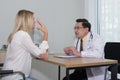 Woman talking to doctor psychiatrist in hospital