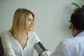 Woman talking to doctor psychiatrist in hospital