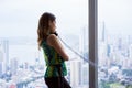 Woman Talking With Wired Telephone In Office Looking Outside Win Royalty Free Stock Photo