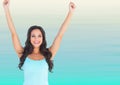 Woman in tank top celebrating against blurry blue and white background