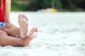 A Woman tanned legs on sand beach. Travel concept. Royalty Free Stock Photo