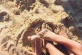 Woman tanned legs on sand beach. Travel concept. Happy feet in tropical paradise. Royalty Free Stock Photo