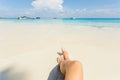 Woman tanned legs on sand beach. Travel concept. Happy feet in tropical paradise Royalty Free Stock Photo