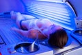 Woman on tanning bed Royalty Free Stock Photo