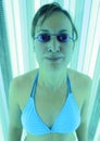 Woman tanning in solarium Royalty Free Stock Photo