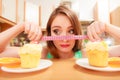 Woman with tape measure and cake. Diet dilemma. Royalty Free Stock Photo