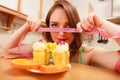 Woman with tape measure and cake. Diet dilemma. Royalty Free Stock Photo