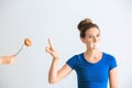 Woman with taped mouth refusing to eat unhealthy food on white background. Diet concept Royalty Free Stock Photo