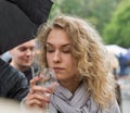 Woman taste wine during Kyiv Food and Wine Festival, Ukraine. Royalty Free Stock Photo