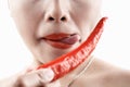 Woman tasting big red chili Royalty Free Stock Photo