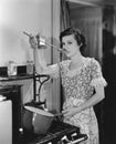 Woman tasting food cooking on stove Royalty Free Stock Photo