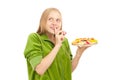 Woman tasting variety of fruits and berries