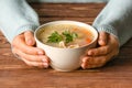 Woman with tasty rice soup at table Royalty Free Stock Photo