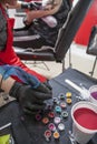 Woman tattoo artist refilling her pen