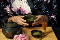 Woman tea master in kimono performs tea ceremony. Royalty Free Stock Photo