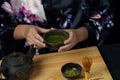 Woman tea master in kimono performs tea ceremony. Royalty Free Stock Photo