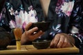 Woman tea master in kimono performs tea ceremony. Royalty Free Stock Photo