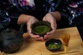 Woman tea master in kimono performs tea ceremony. Royalty Free Stock Photo