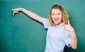 Woman teacher in front of chalkboard. Teacher explain hard topic. Good teacher master of simplification. Important