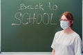 Woman teacher stands next to the text Royalty Free Stock Photo