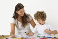Woman teaches her child how to draw Royalty Free Stock Photo