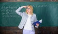 Woman teaching near chalkboard. Effective teaching involve acquiring relevant knowledge about students. What make great Royalty Free Stock Photo