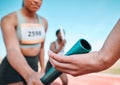 Woman, team and hands with baton in relay, running marathon or sports fitness on stadium track. Closeup of people Royalty Free Stock Photo